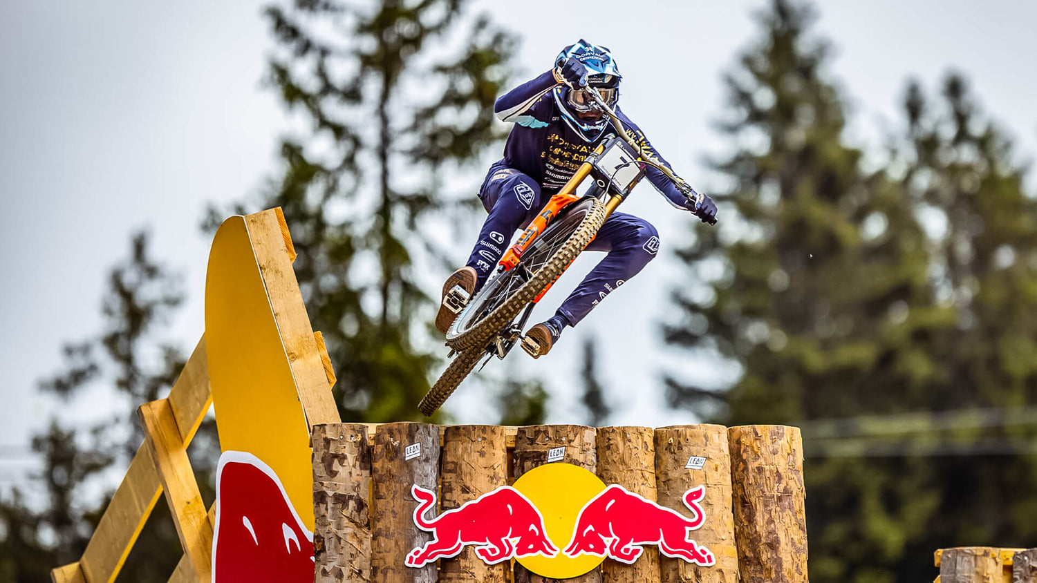 Troy Lee Designs downhill rider going over a ramp